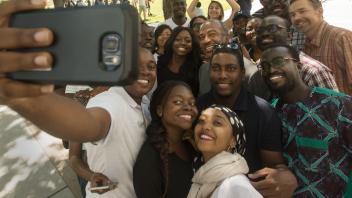 Chancellor Gary May does photographs with the young African leaders of the Mandella Fellowship after he spoke with them about his life and challenges during a meeting of the Mandela Fellows on July 28, 2017 at the International Student Center.