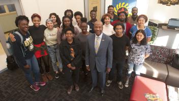 UC Davis Chancellor Gary May stand with students at the Center of African Diaspora Student Success on December 1, 2017.