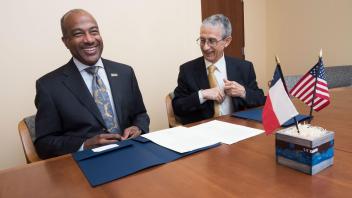 Signing an "Agreement of Cooperation" during a meeting with a delegation from Chile on Friday, January 12, 2018. Dr. Jose Rodriguez, Rector Universidad Andres Bello (UNAB) is pictured with Chancellor May. UNAB is a private university with the largest student enrollment in Chile and is also the most important academic partner of the UC Davis-Chile Center.
