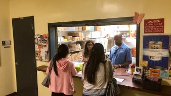 UC Davis Chancellor May volunteers at the student-run Pantry. 