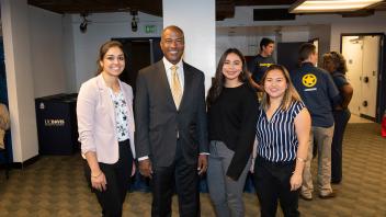 UC Davis Chancellor Gary May poses for a photo with the student speakers at the UC Davis' Fall Welcome Event.