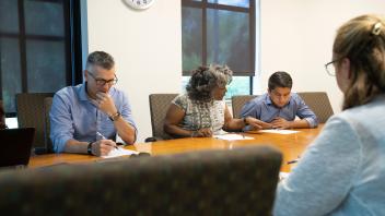 Political Science major, Mohammad Qayum, attends a Student Housing meeting while he shadows Emily Galindo, the Interim Vice Chancellor for Student Affairs.