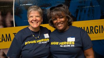 Kelly Ratliff, Vice Chancellor of FOA and Interim Vice Chancellor of Student Affairs, Emily Galindo, volunteer to help run and greet students at the new Fall Welcome Celebration “Aggie Heroes.” 
