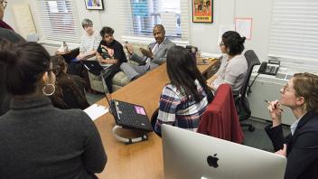 Chancellor Gary May sits and talks with students at the Women's Resources and Research Center