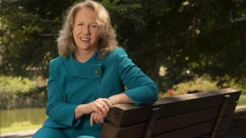 provost mary croughan on a bench