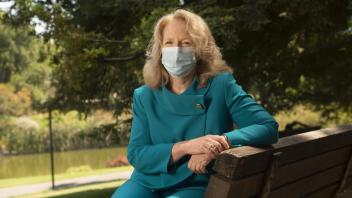 provost mary croughan at a bench