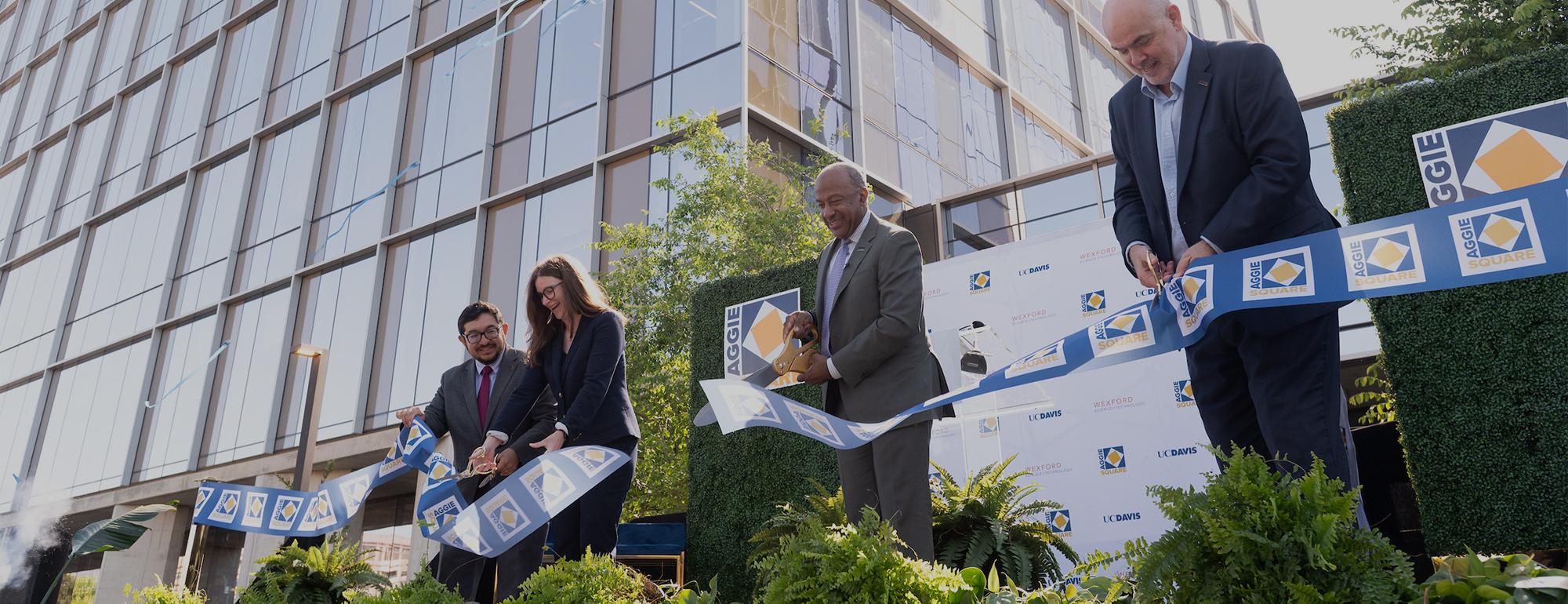 Sacramento Mayor Pro Tem Eric Guerra; Claire Drummond, Vice President for Development, Wexford Science & Technology; UC Davis Chancellor Gary S. May; and UC Davis Chief Innovation and Economic Development Officer George Baxter formally cut the ribbon to inaugurate Aggie Square