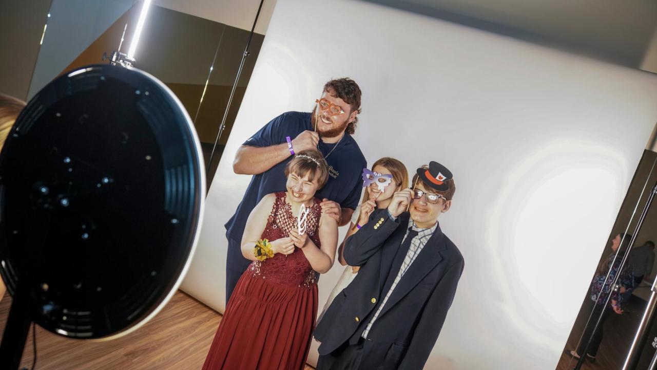 UC Davis football offensive lineman Kooper Richardson, left, poses with his Shining Stars prom date Montana Klentz in Rocklin. Richardson and four teammates escorted dates to the special needs prom. UC Davis football player Kooper Richardson poses with prom attendees.