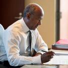 Chancellor May sitting at desk writing a letter