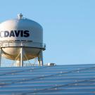 UC Davis water tower with solar panels in the foreground.